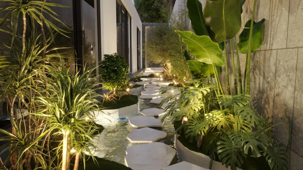 Stepping-stone path through dense planting beside a building.
